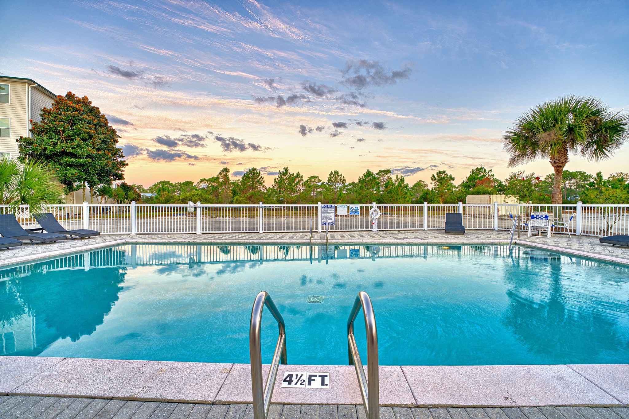 Private condo pool at sunset, exclusive to condo guests at St. James Bay in Carrabelle, FL